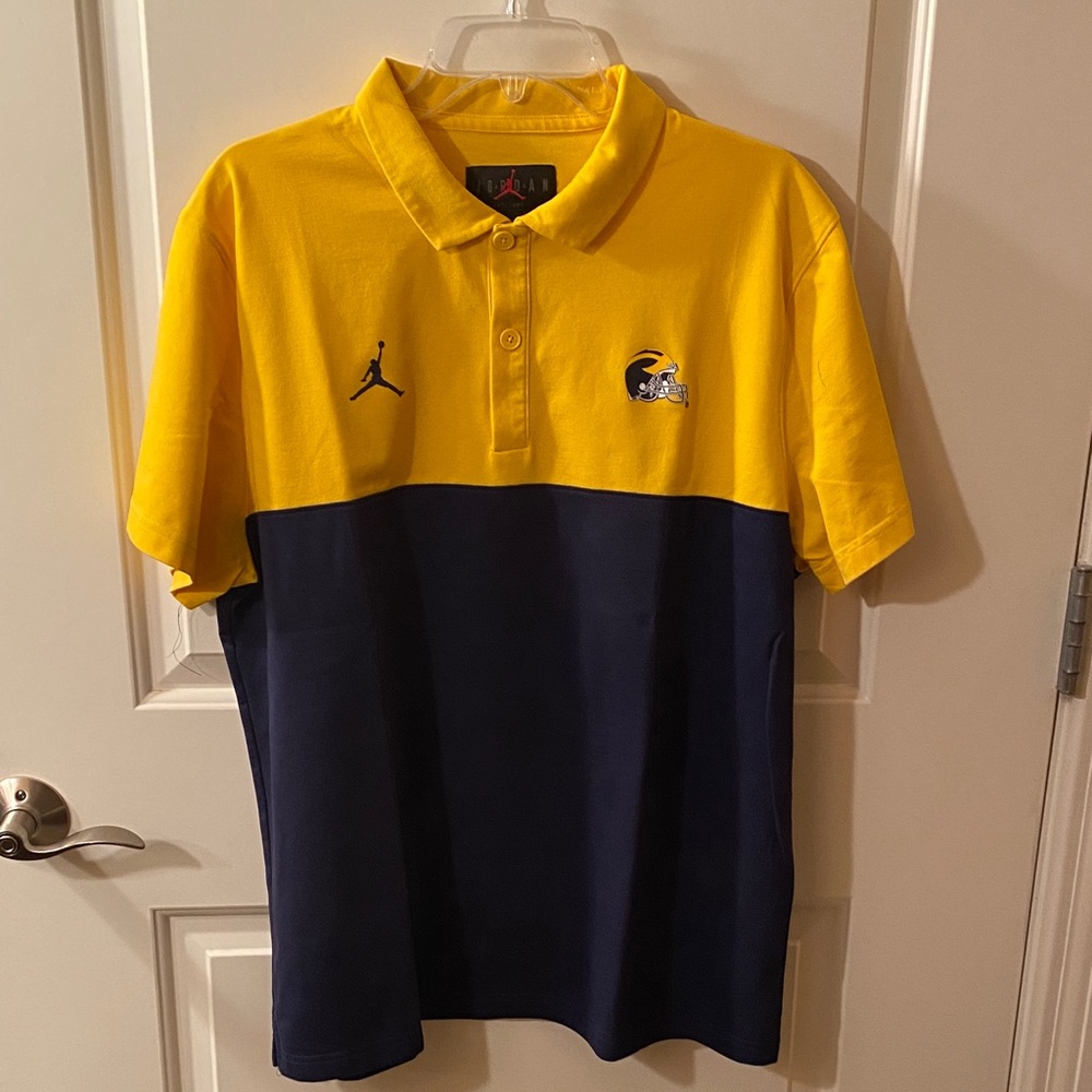 Jordan Men’s Michigan Wolverines Maize and Blue Polo with Michigan Helmet